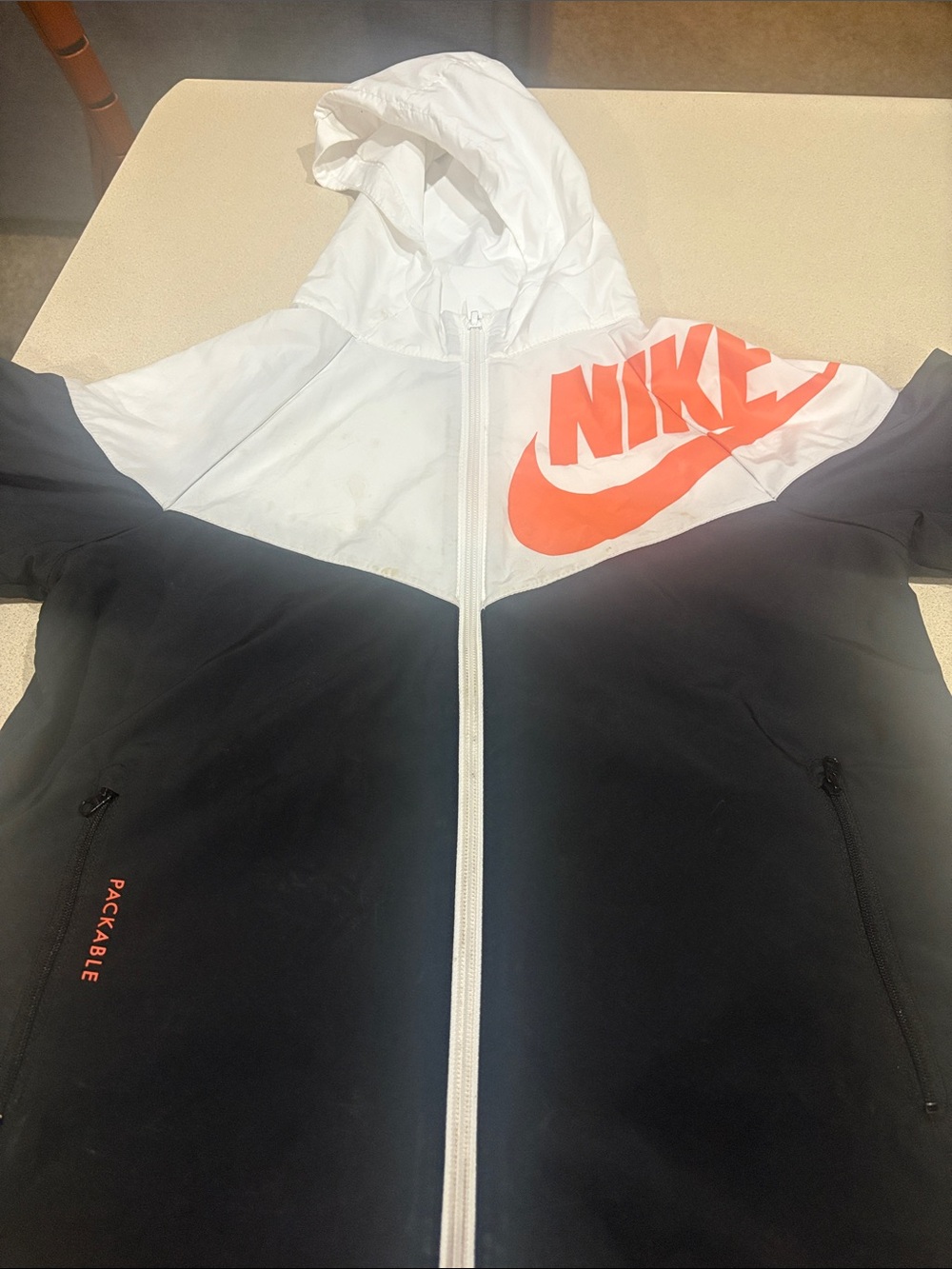 Nike Black and White Hooded Windbreaker with Bright Orange Logo